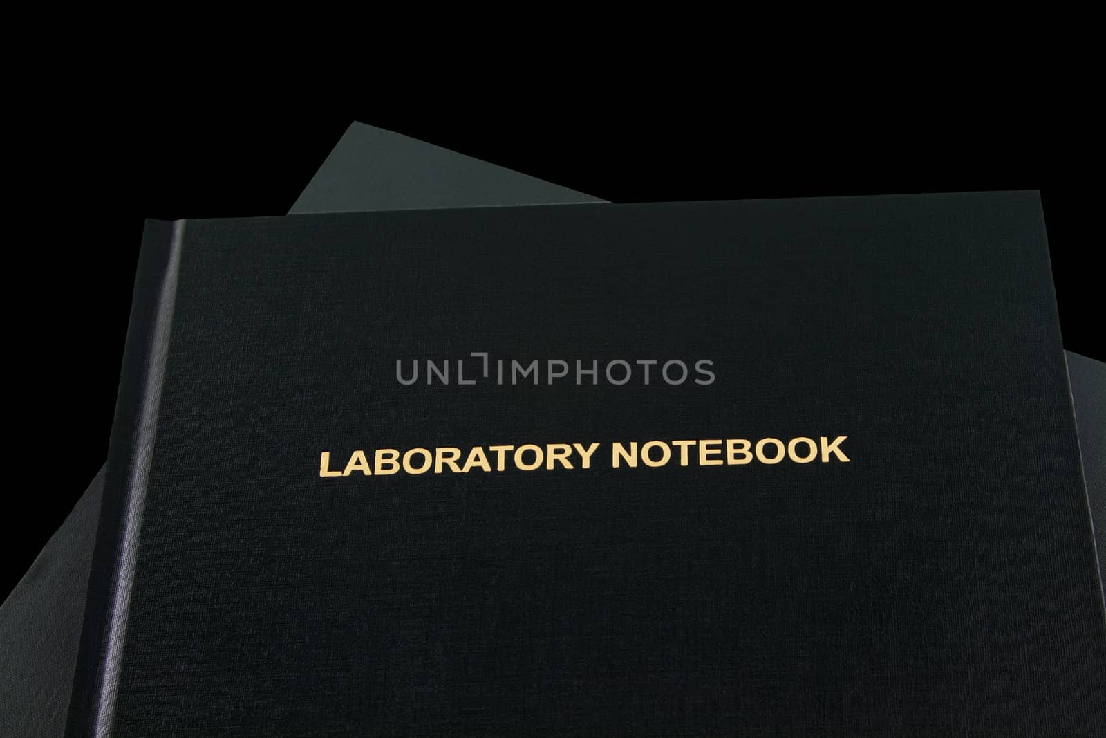 Science, technology, engineering and math studies depicted with two laboratory notebooks with gold lettering visible on one; needed national skills and education initiative emphasis; 