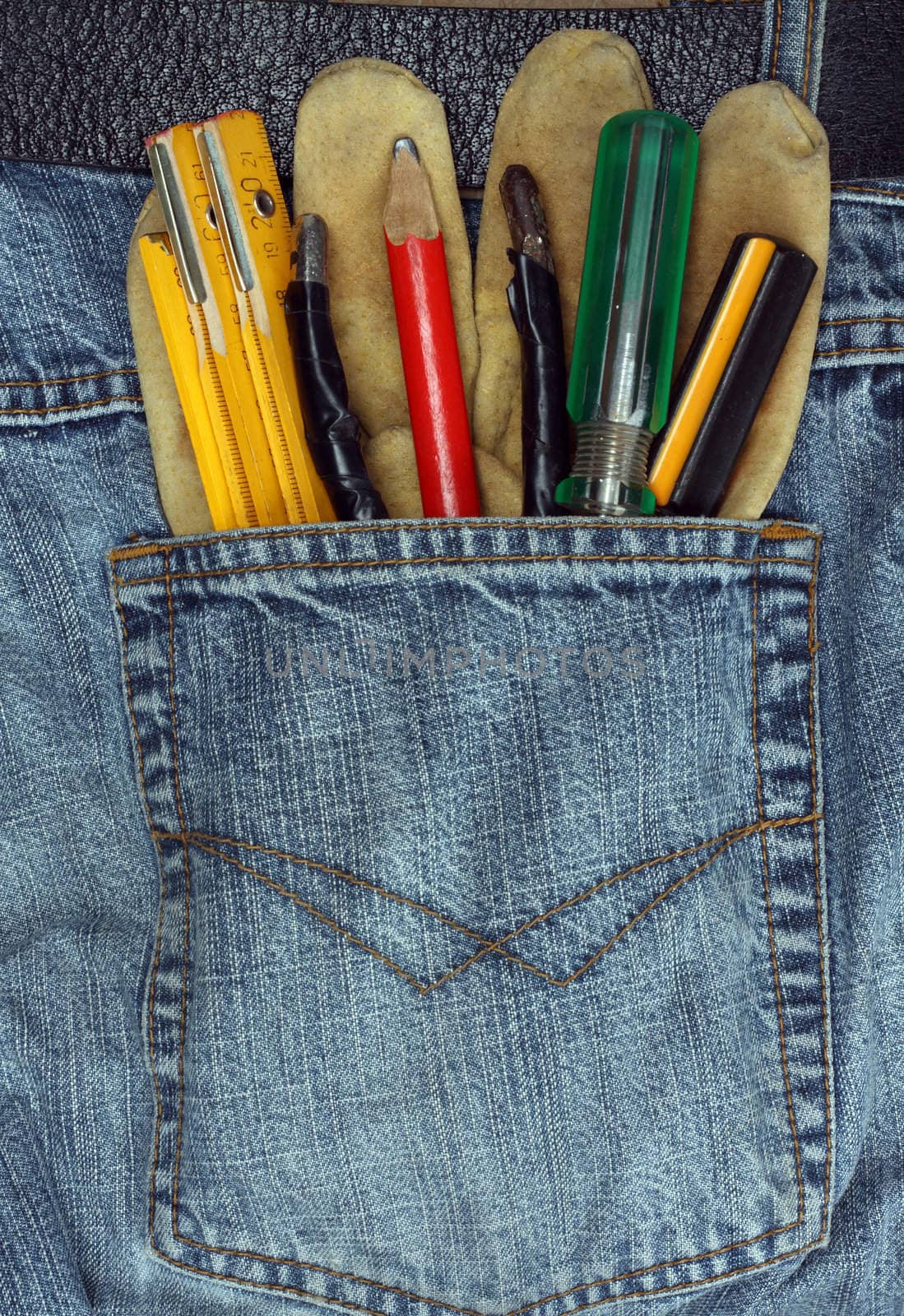 tools in the back pocket of jeans