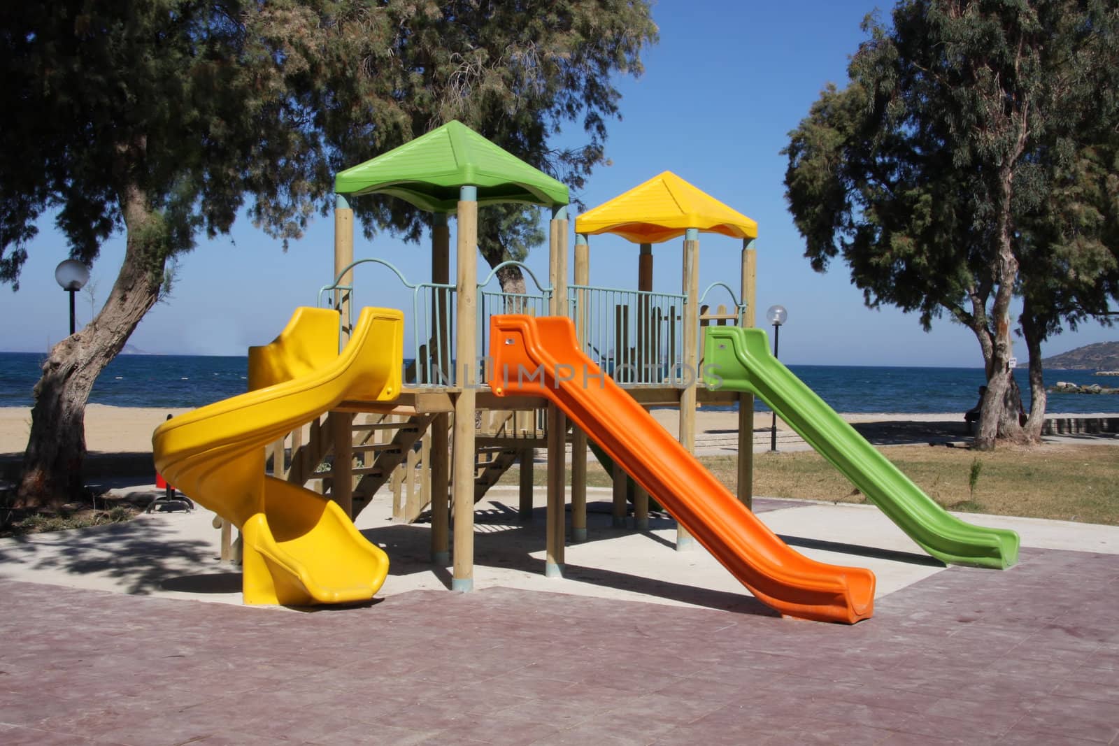 Colourful Childrens Playground with the ocean in the background