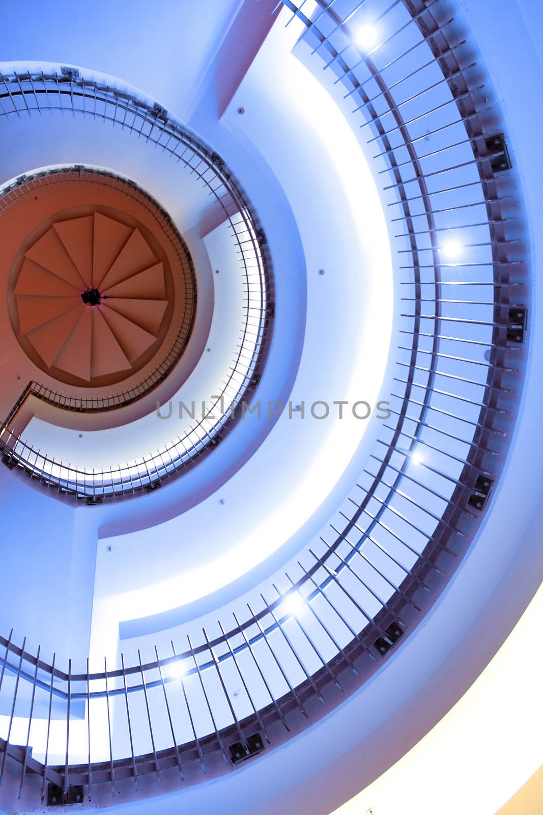 modern designed spiral stair with red top