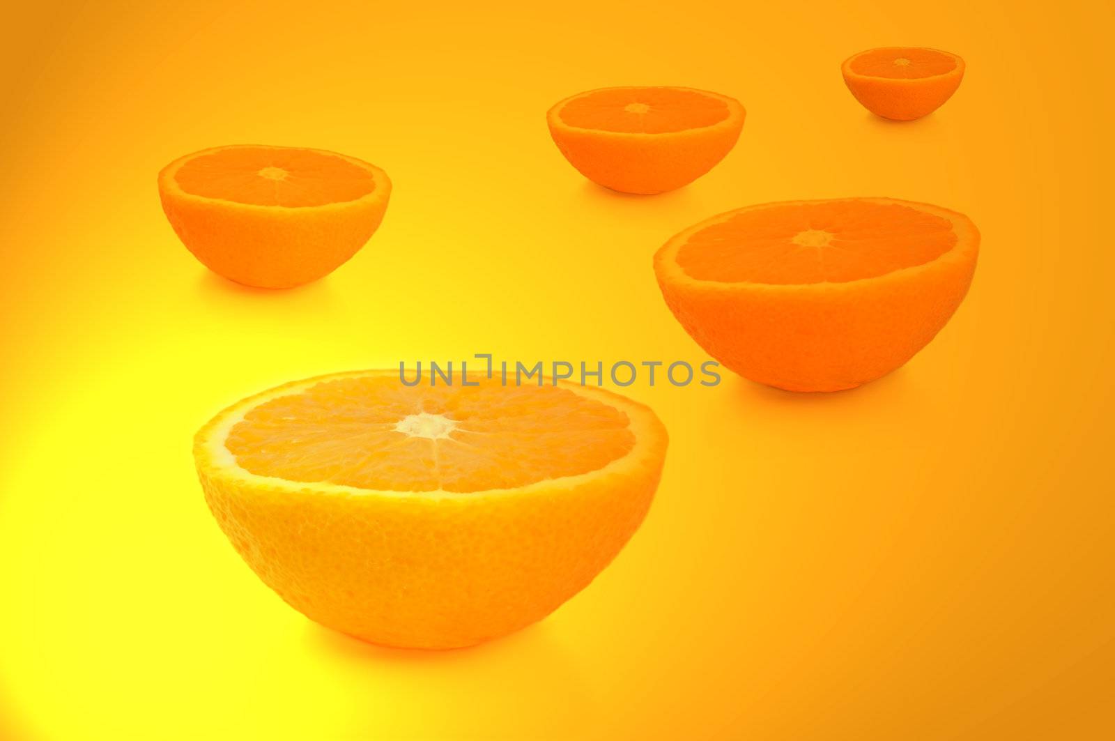 FIve freshly cut orange halves arranged over vibrant yellow and gold light effect.
