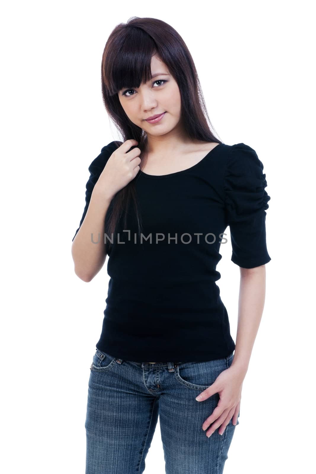 Portrait of a casual young Asian woman posing over white background.