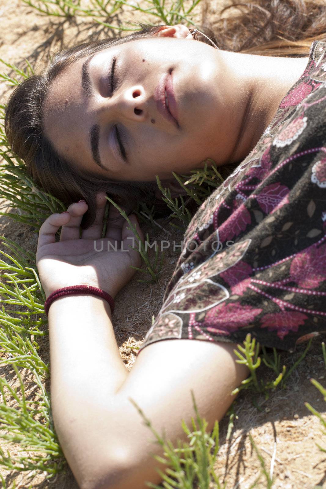 girl sleeping on grass by membio