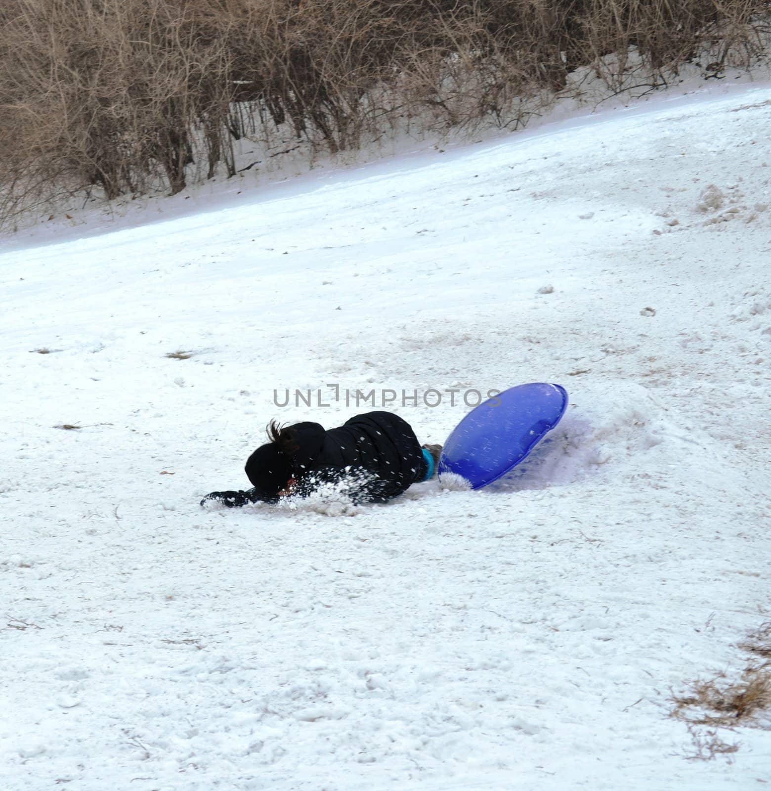 sledding wipeout by RefocusPhoto