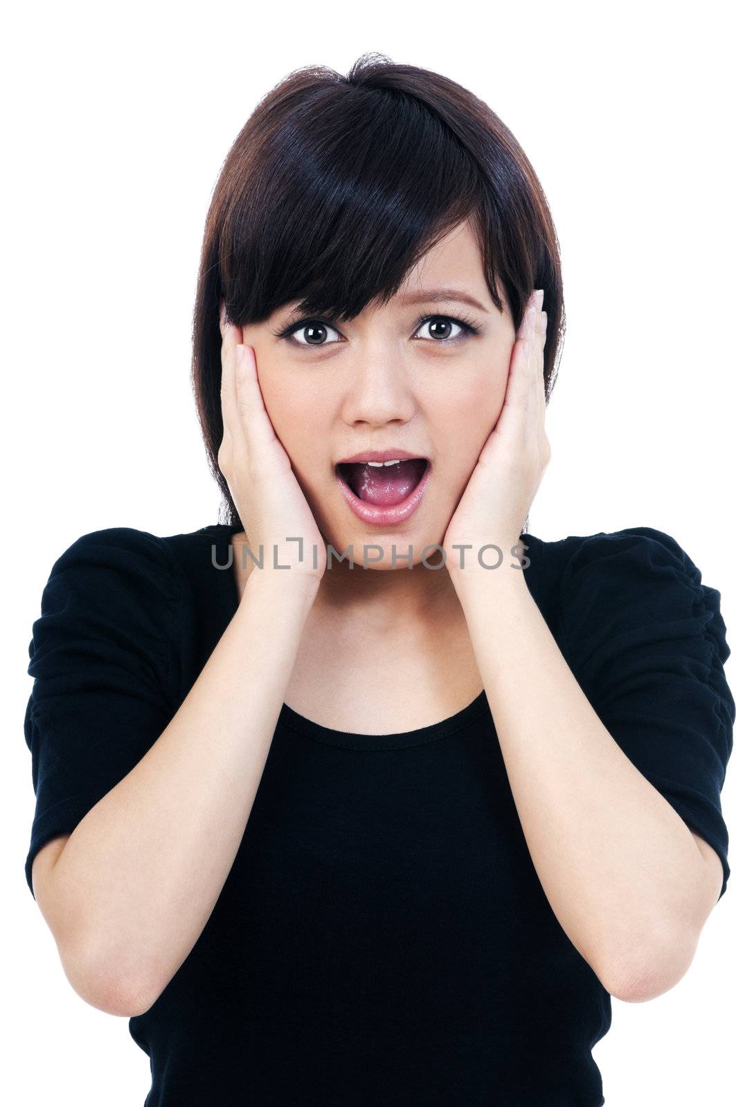 Portrait of a cute young woman looking surprised, isolated on white background