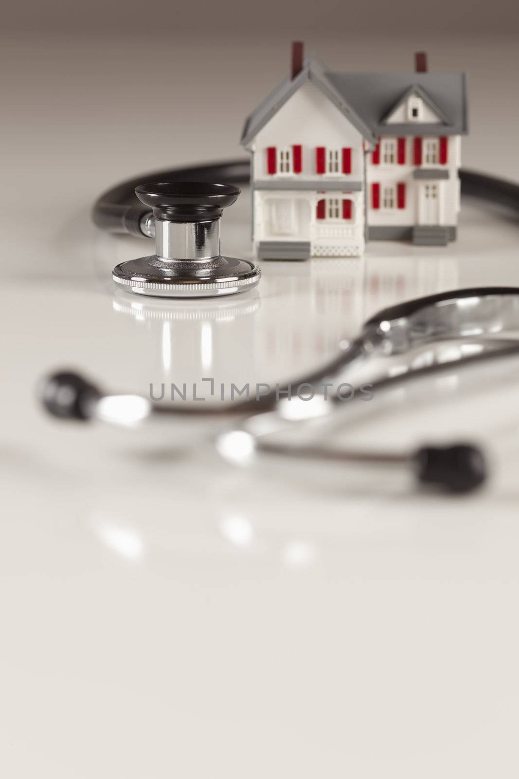 Stethoscope with Small Model Home by Feverpitched