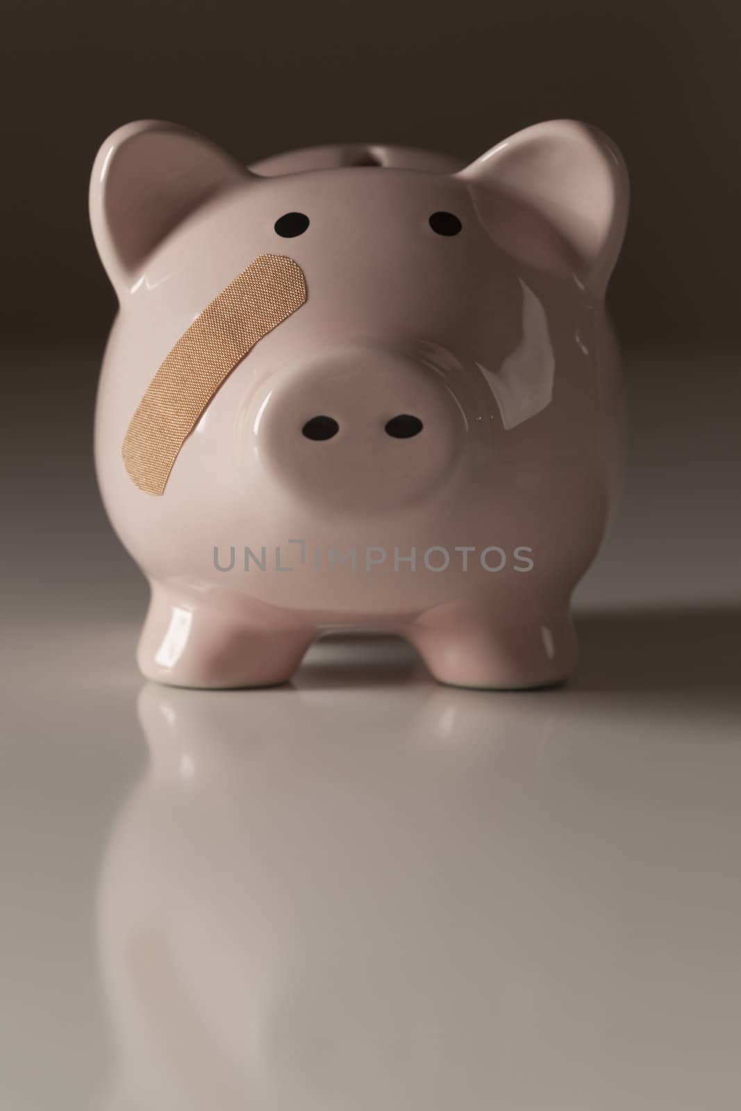 Piggy Bank with Bandage on Face on Gradated Background.