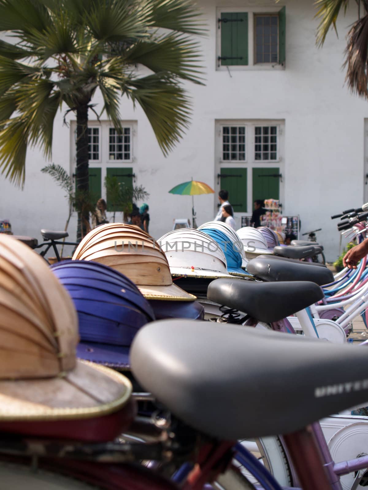 hats on top of an old bicycle.