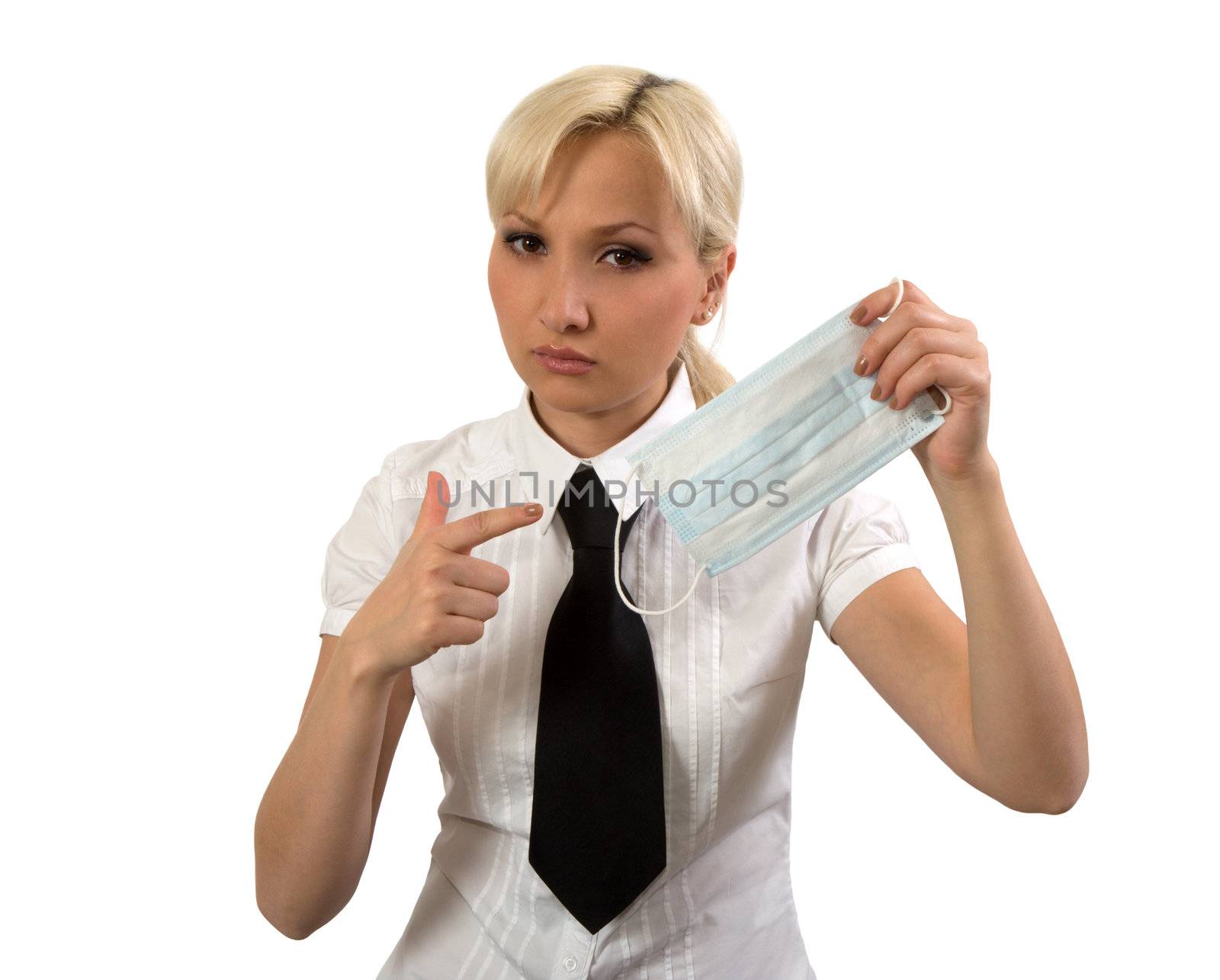 Girl demonstrates surgical mask isolated on a white background.