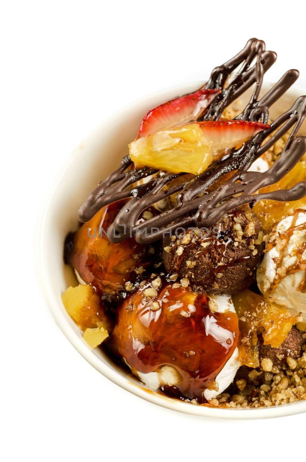 ice cream with chocolate, nuts and caramel close up