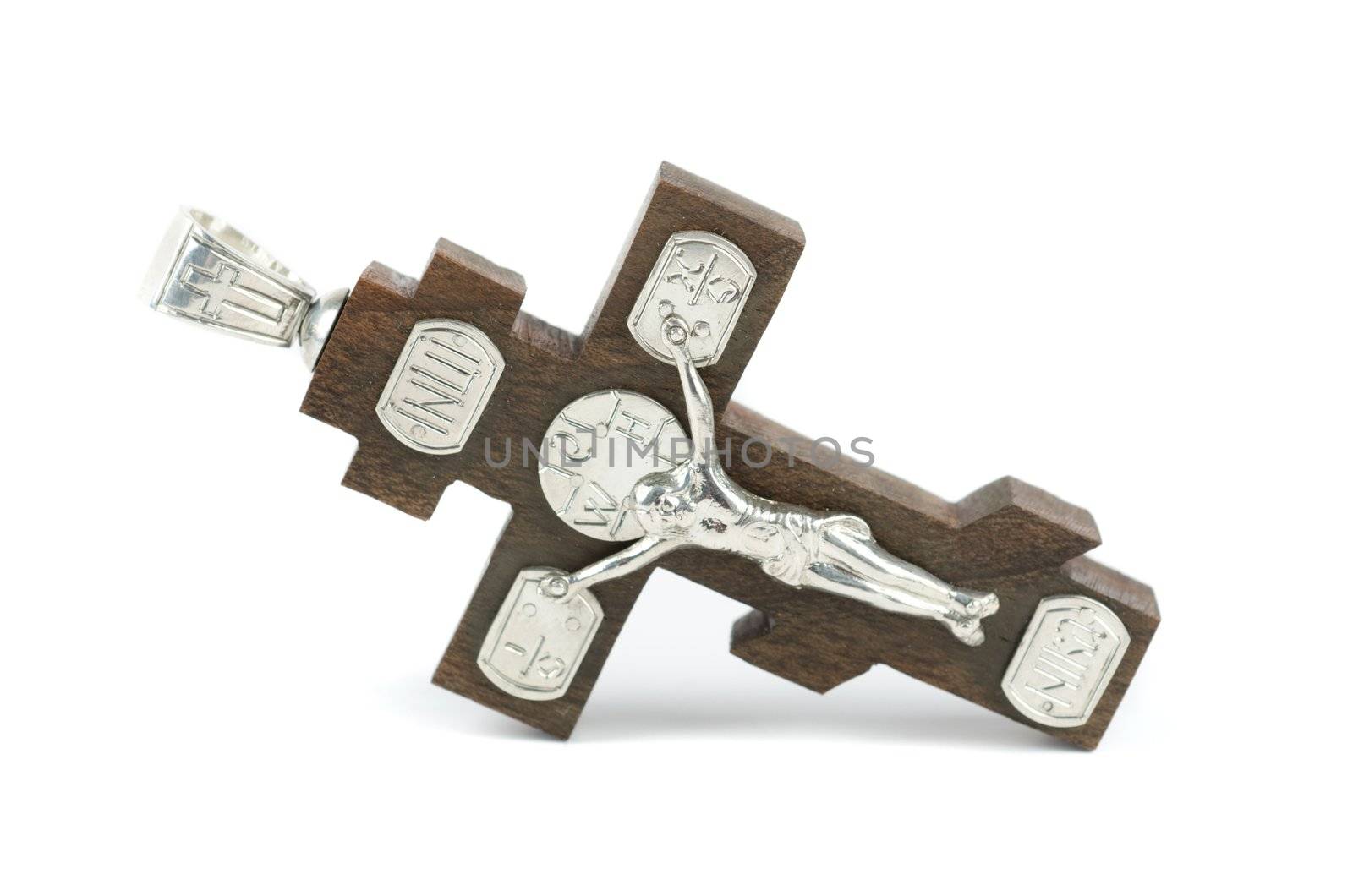 silver and wooden cross with religious inscriptions isolated on a white