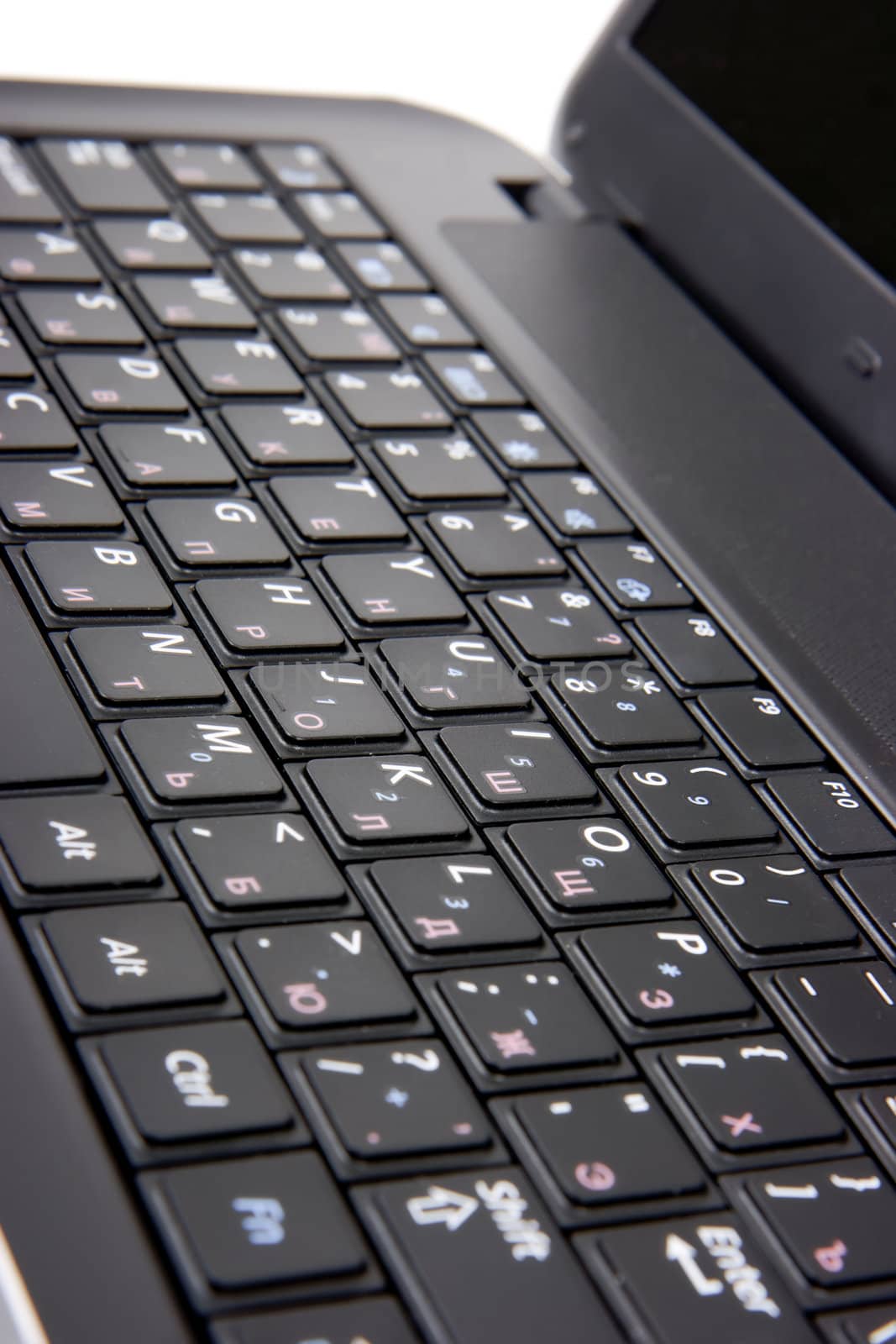 laptop keyboard closeup. Studio shot on white background
