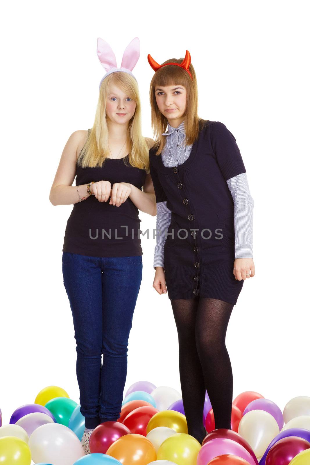 two attractive girls in the costumes of the hare and the devil. White background
