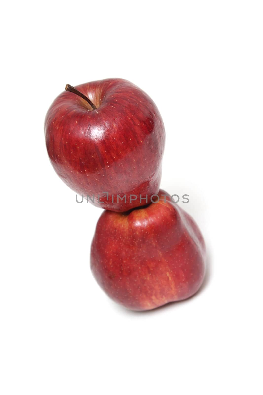 Two red apples isolated on the white background