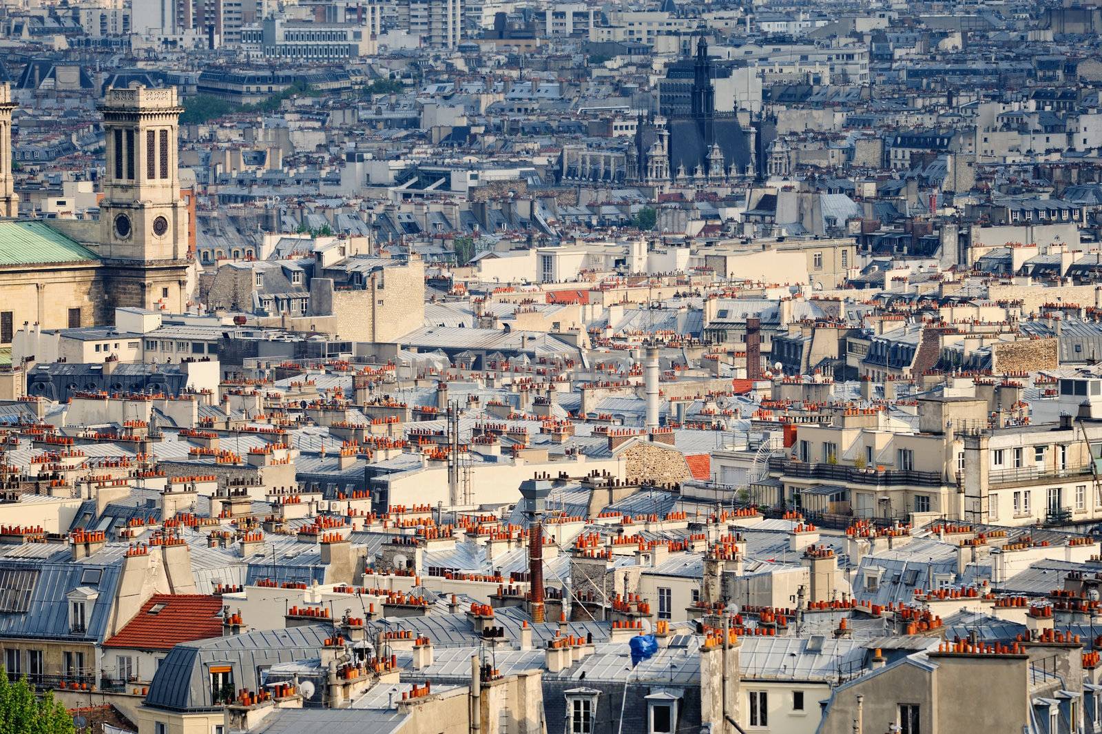 Aerial panorama above houses rooftops in a Paris