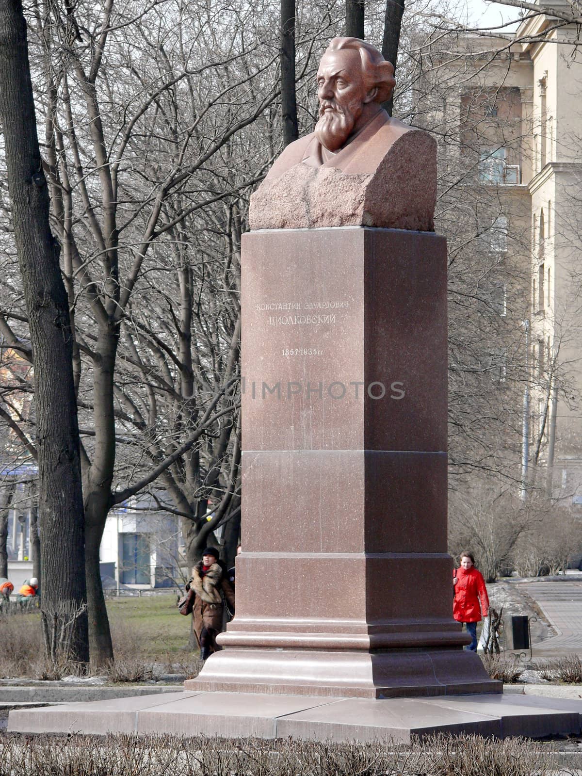 Moscow, Russia - March 27, 2010: Spring day. Peoples walks near monument of Konstantin Tsiolkovsky in Petrovski park. Moscow, Russia