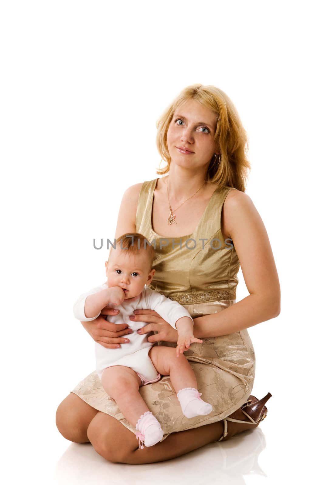 Mother holding five month daughter isolated on white