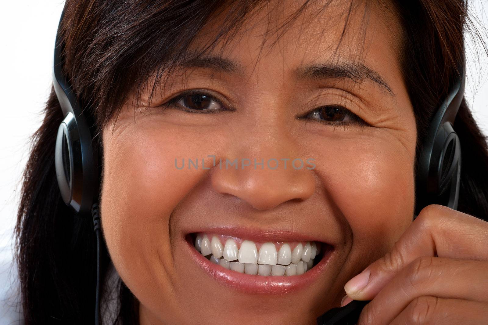 portrait of a happy smiling young Asian woman with a headset
