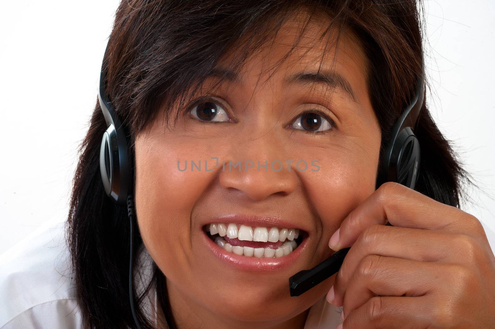 portrait of a happy smiling young Asian woman with a headset