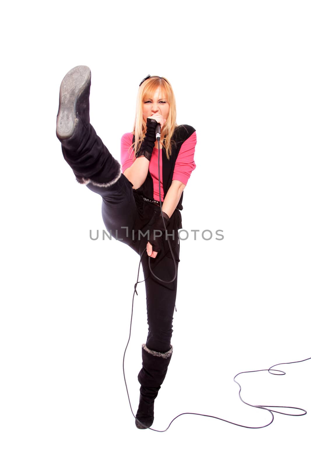 Portrait of female rock singer with microphone in hand