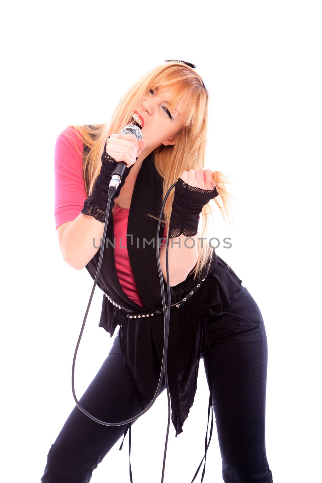 Portrait of female rock singer with microphone in hand