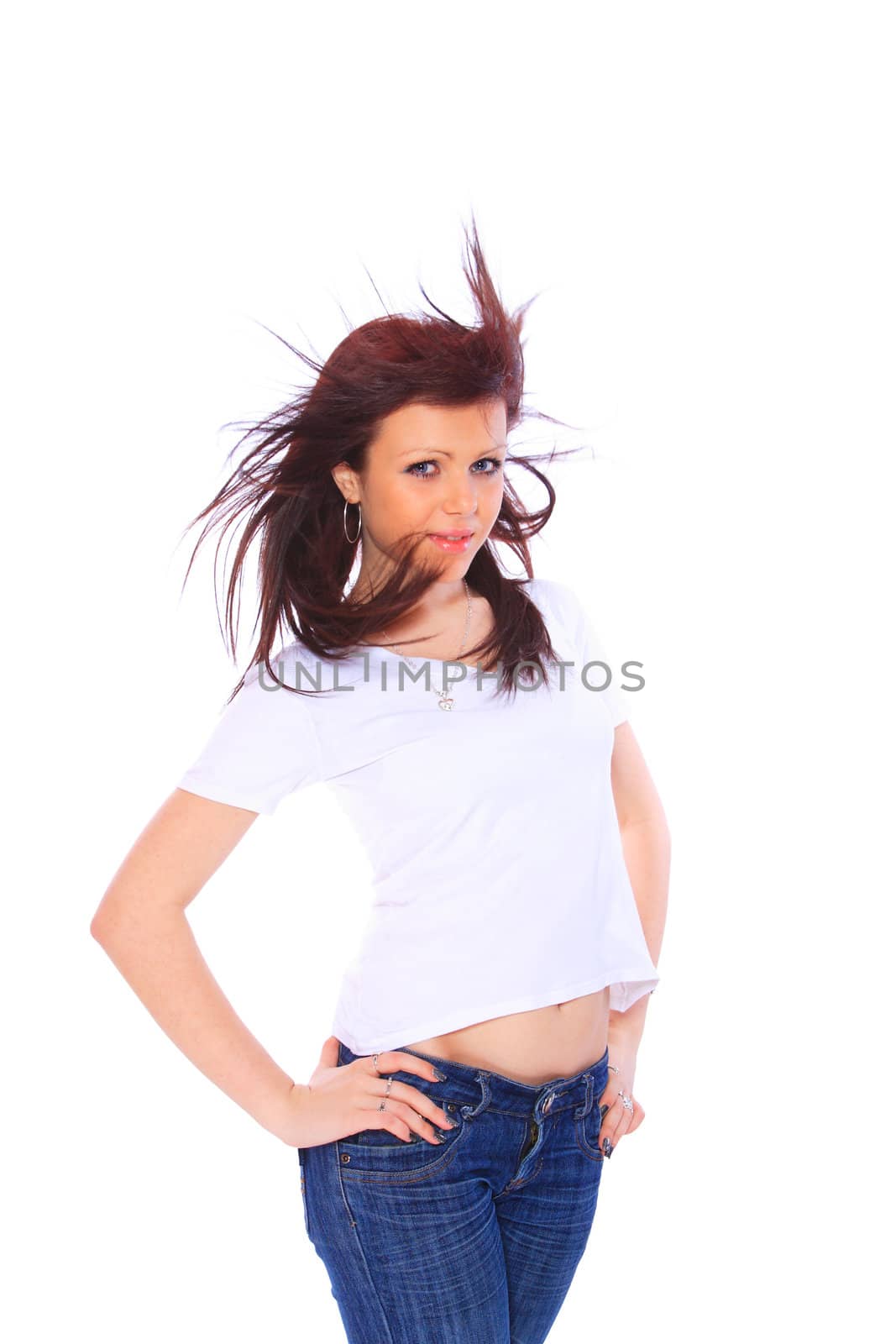smiling young woman in jeans and t shirt, studioshot over white background