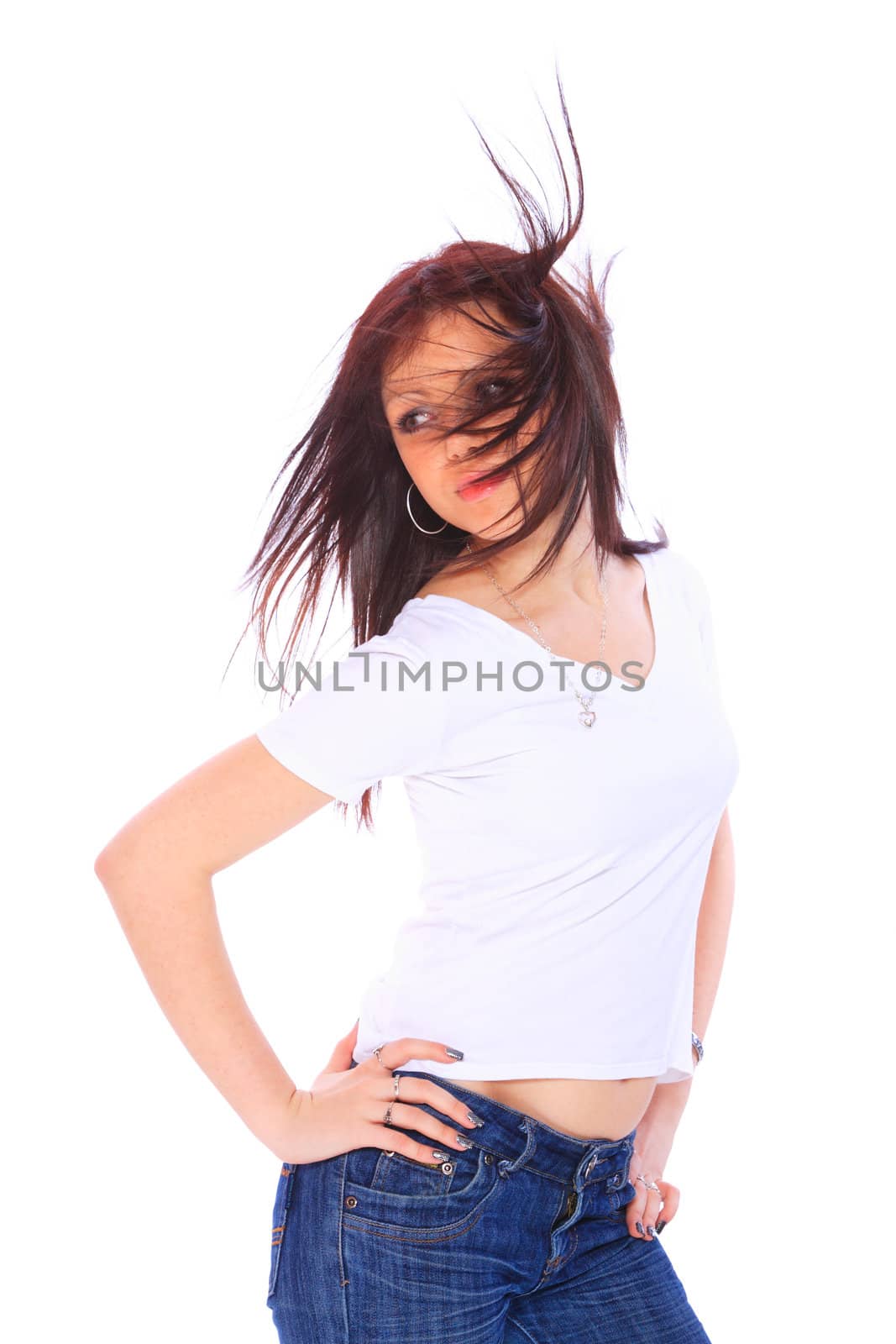 smiling young woman in jeans and t shirt, studioshot over white background
