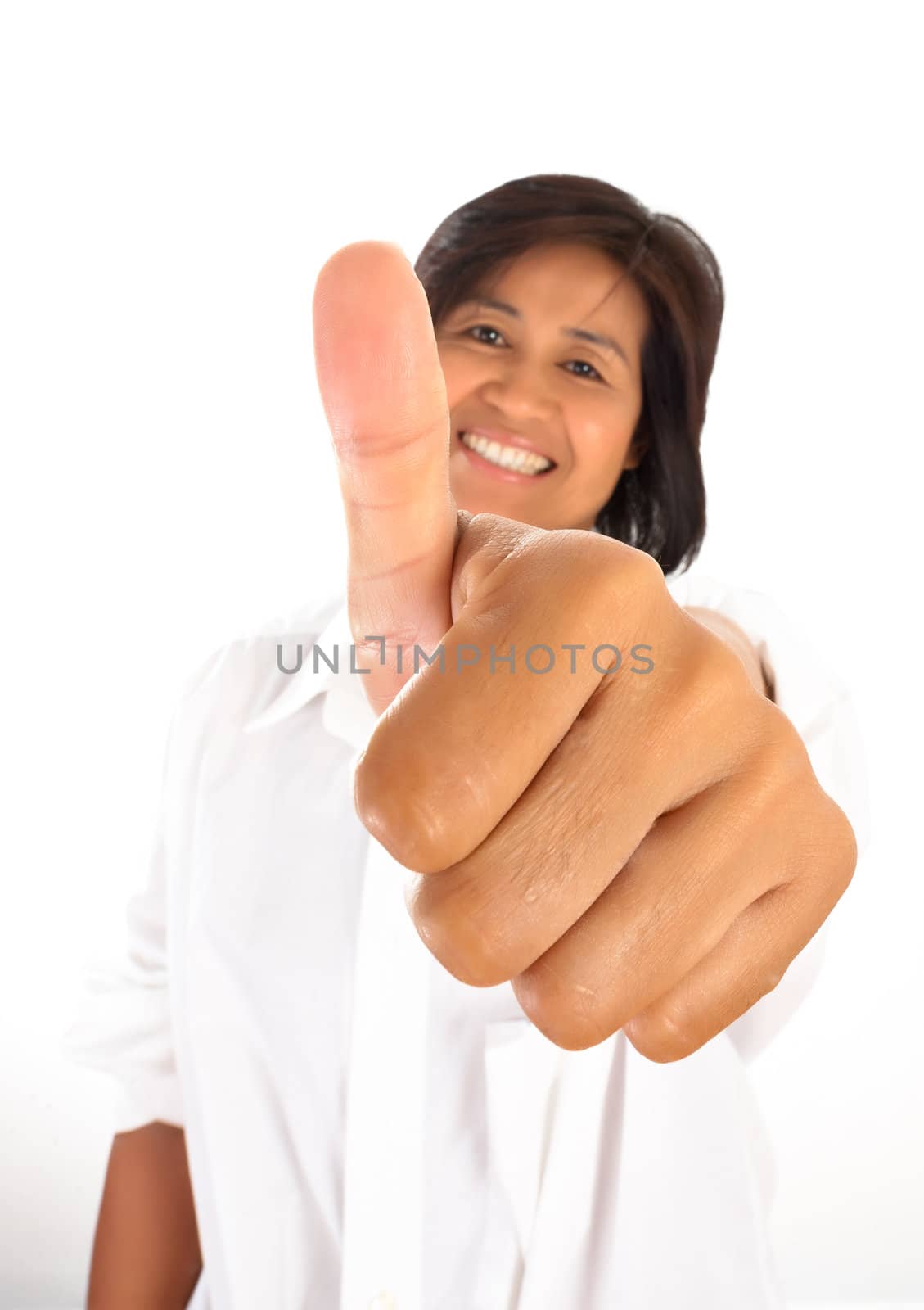 isolated portrait of a young, attractive and happy woman is smiling and shows the thumb