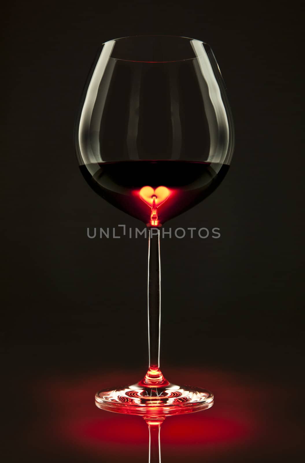 Glass of red wine with a heart inside