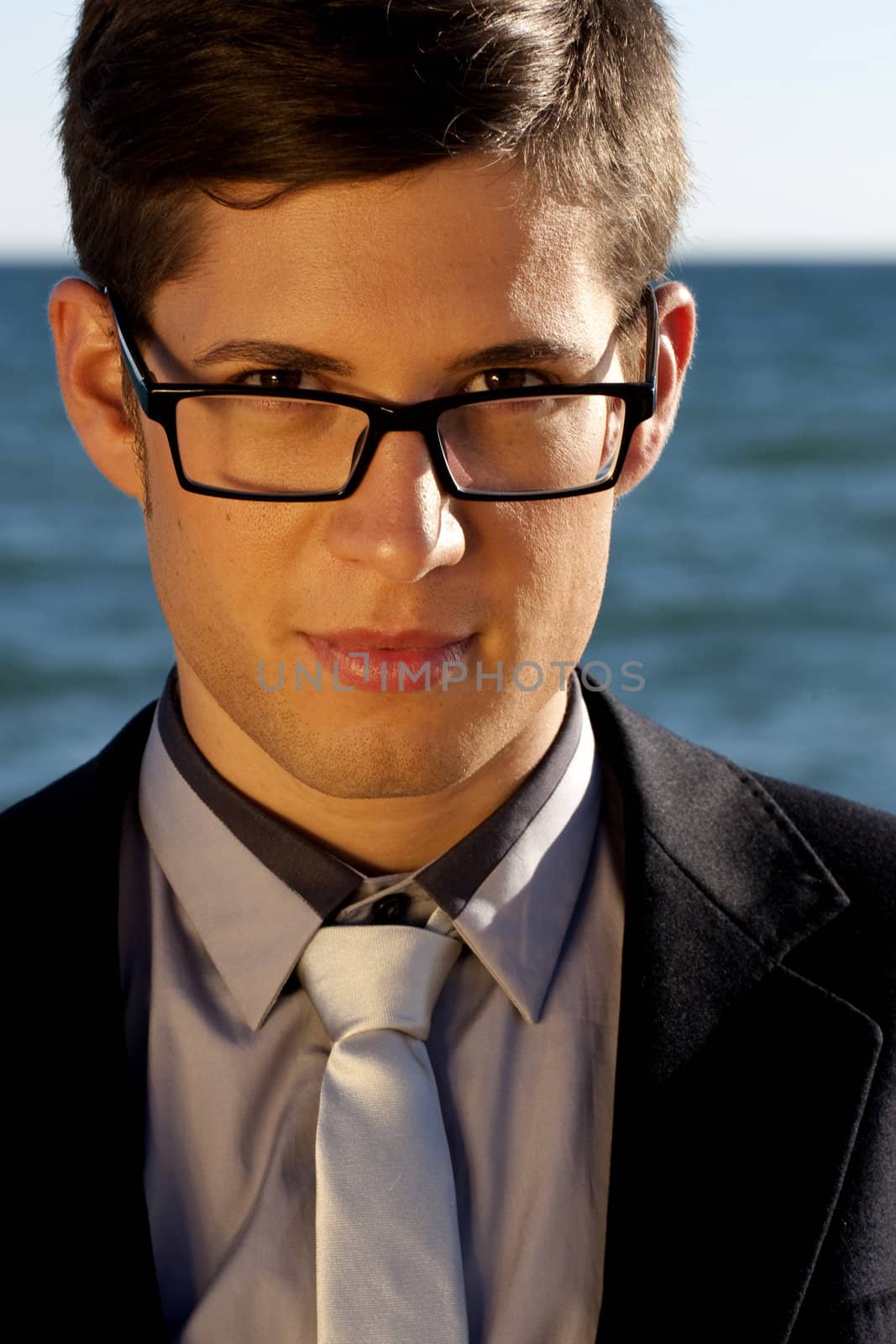 Close up view of a business man with glasses.