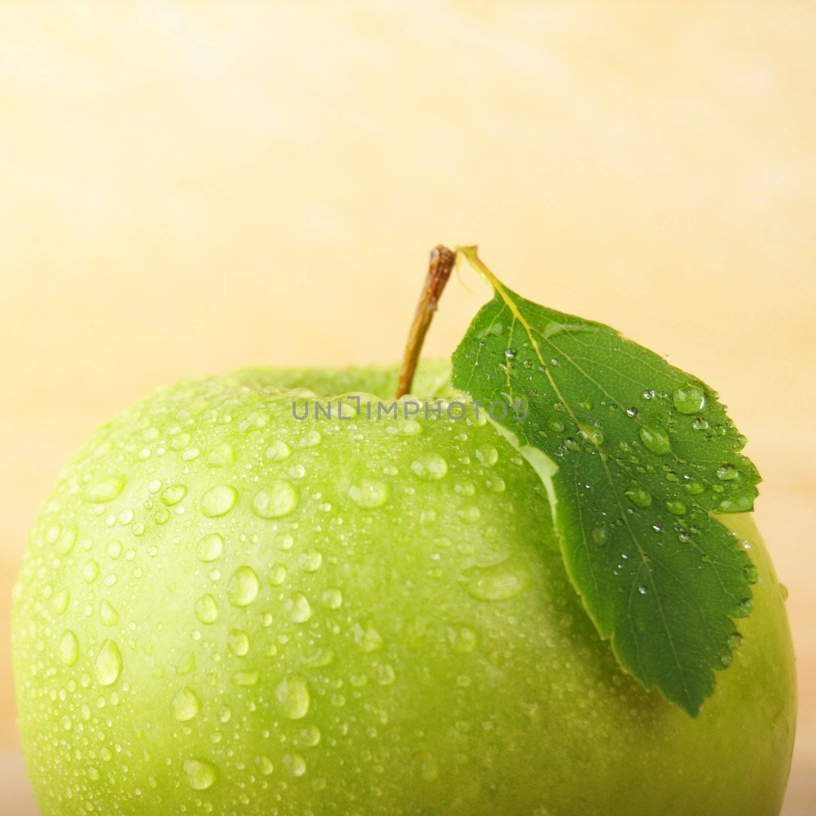 green apple on wood with copyspace showing healthy food concept
