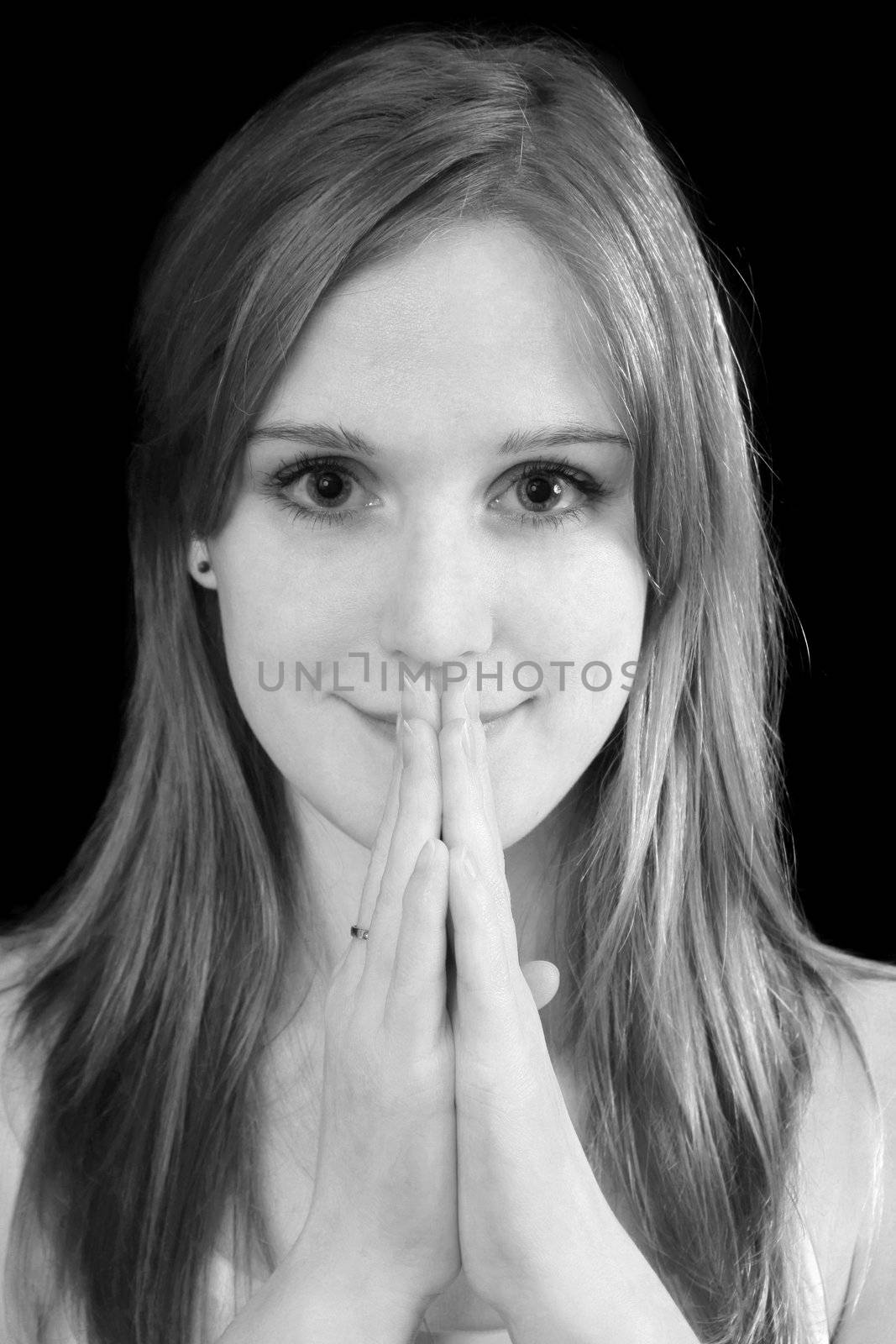charming blonde with hand and on her face in black and white by macintox