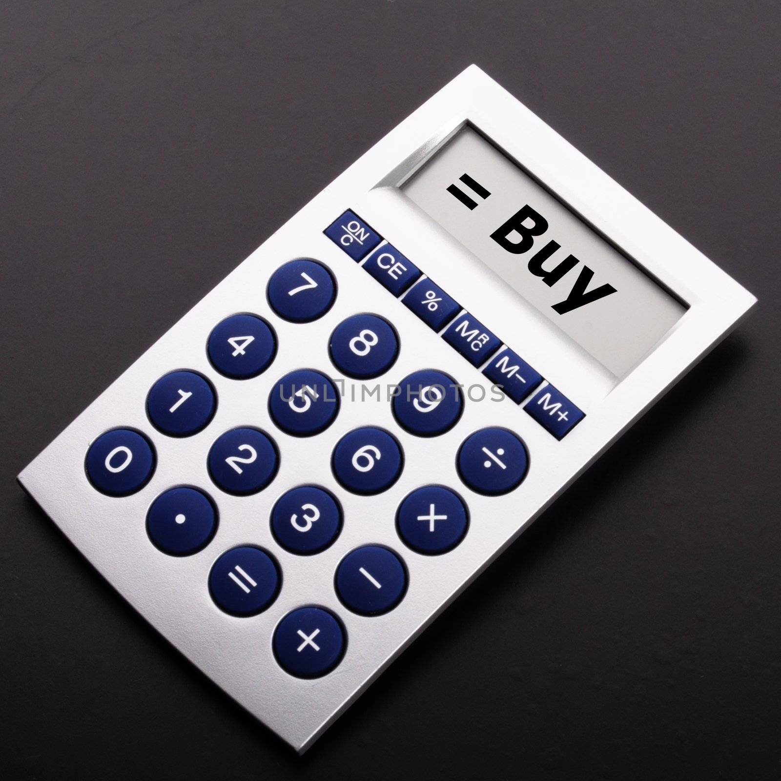 buy on calculator showing stock market or financial investment concept