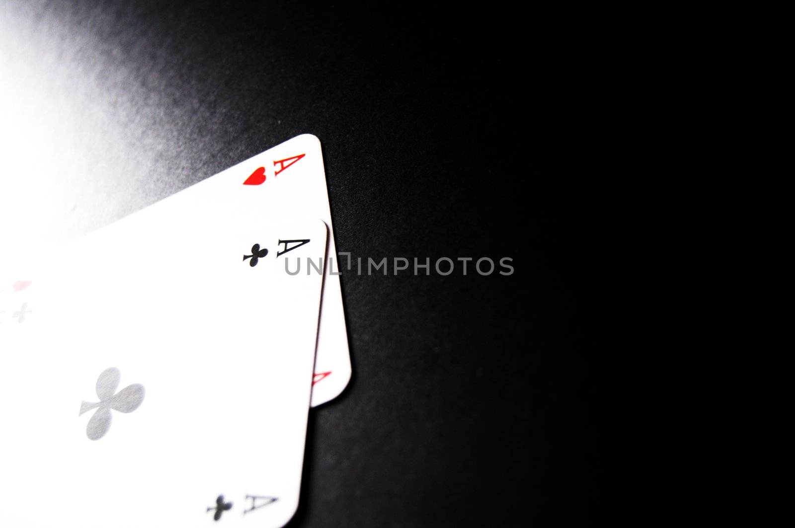 winning concept with four aces on black background