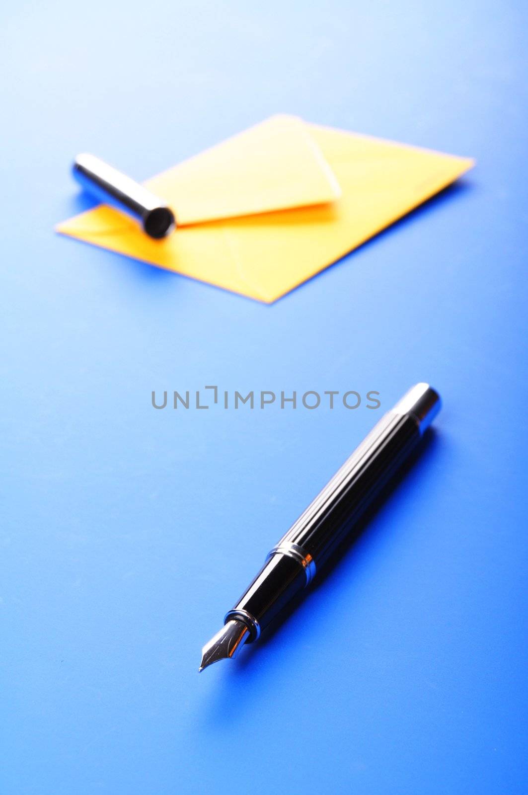 envelop and pen showing mail or communication concept