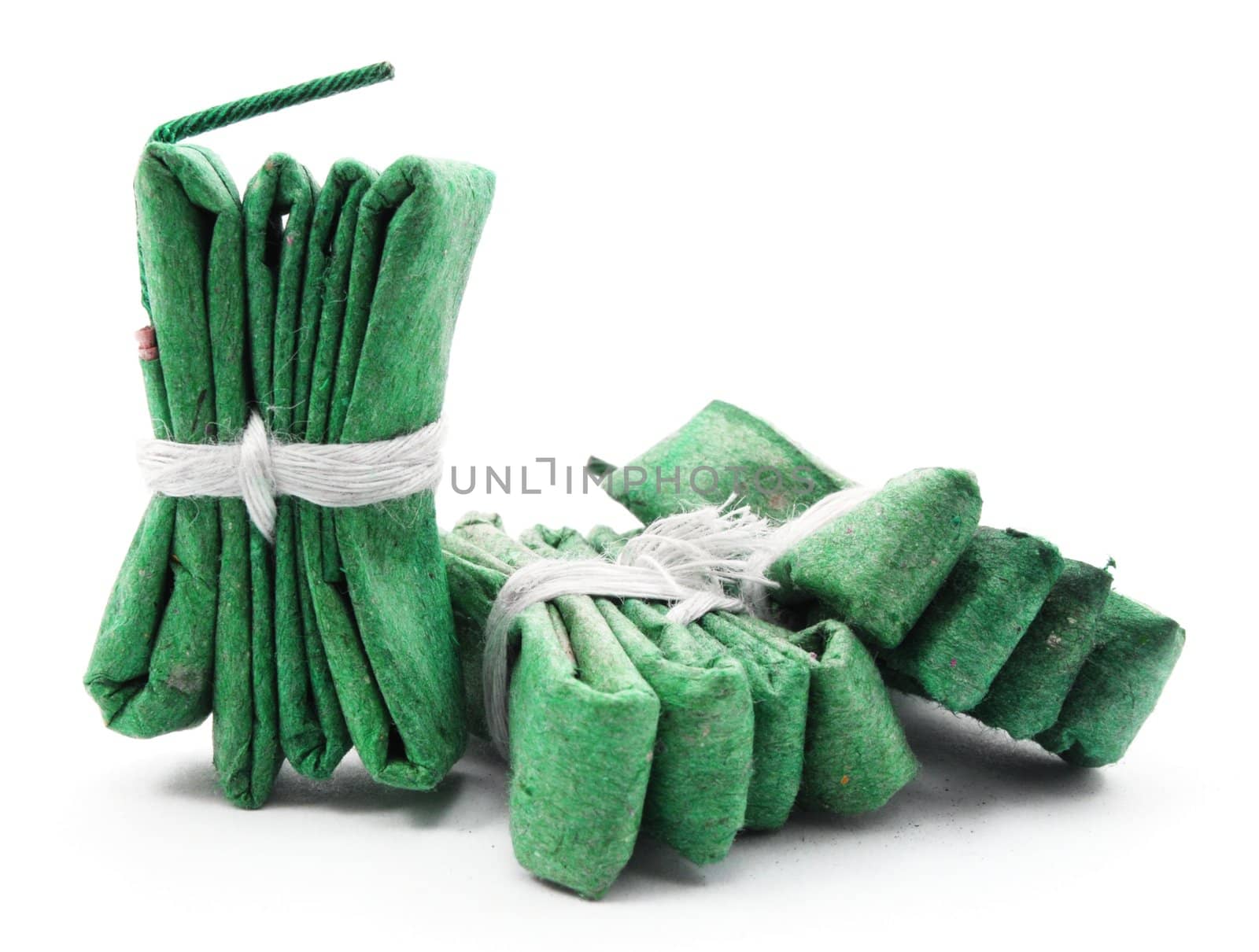 green firecracker isolated on white background showing new year concept