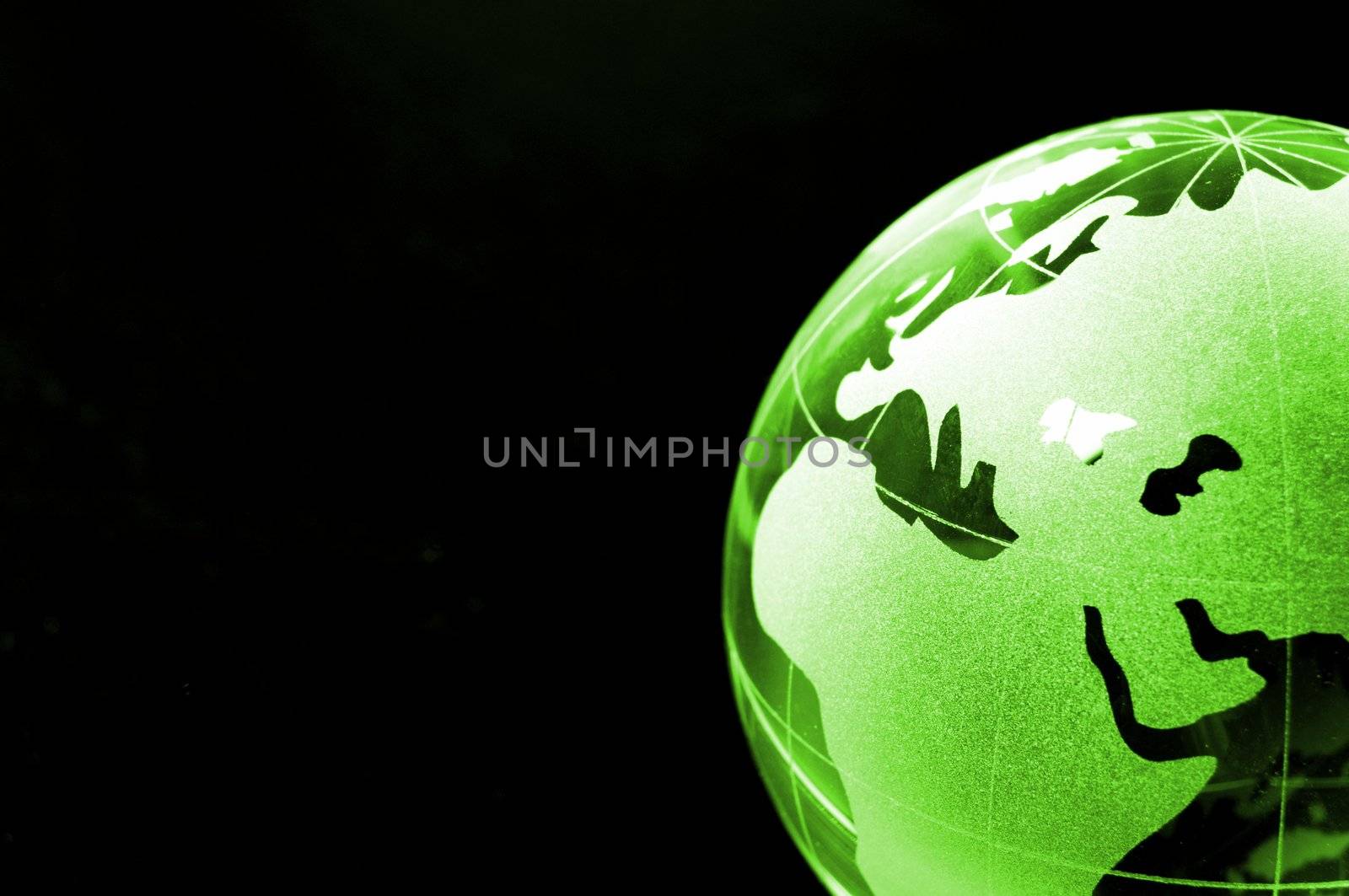 glass globe on black background showing business or environment concept with copyspace