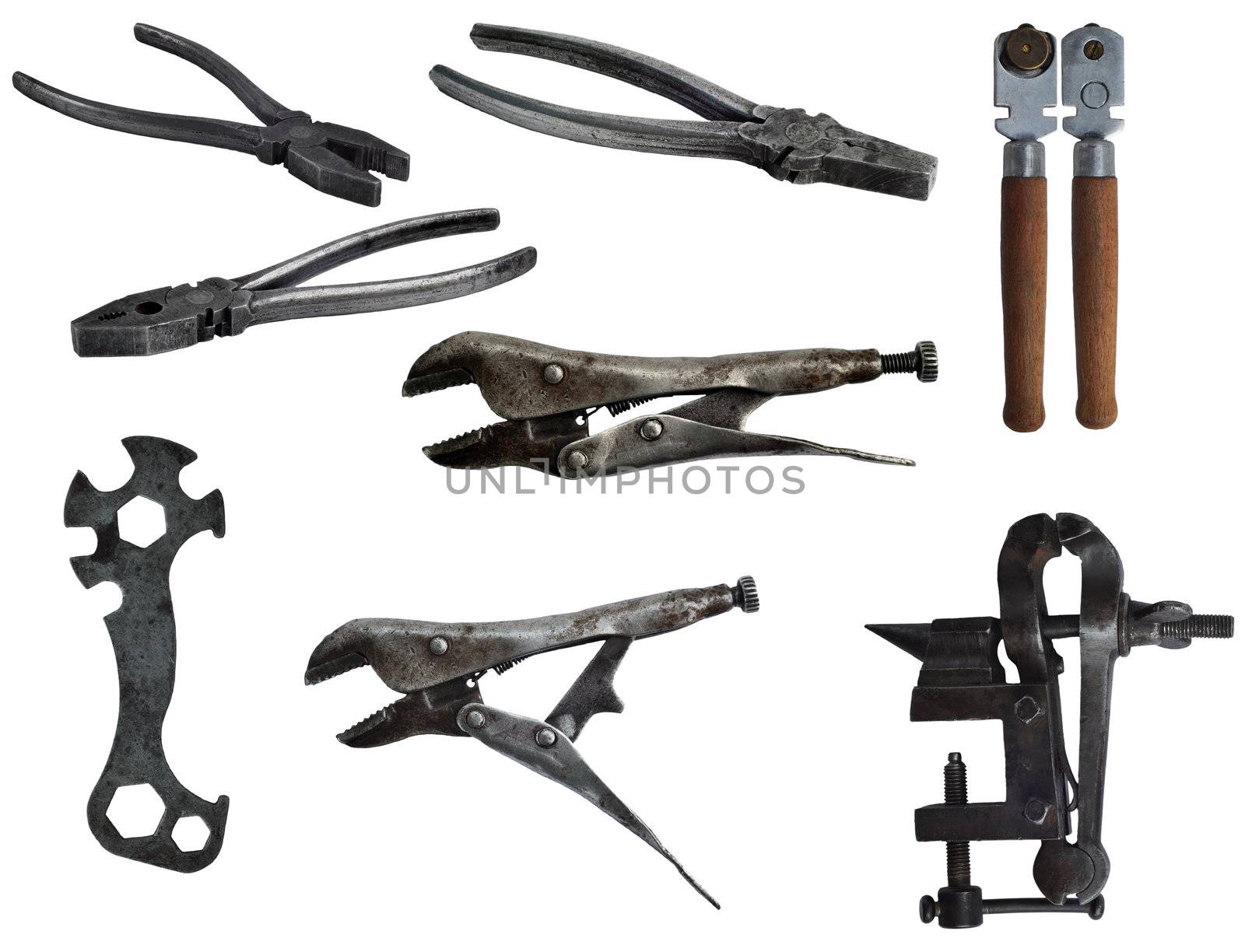 Set of old isolated on white tools of 40-50th years of 20th year: flat-nose pliers, glass-cutter, vice, bicycle spanner
