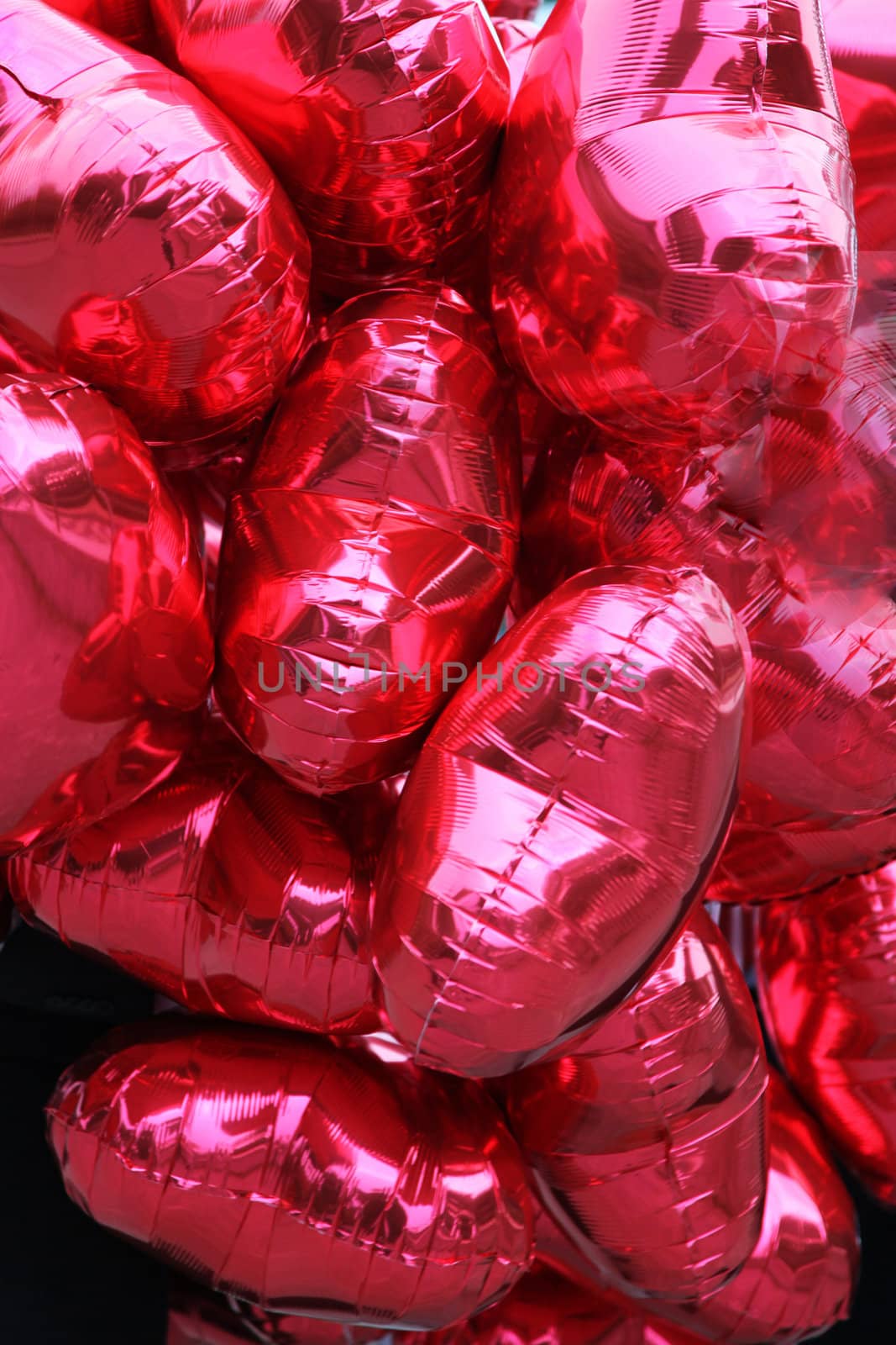 many red, heart-shaped balloons

