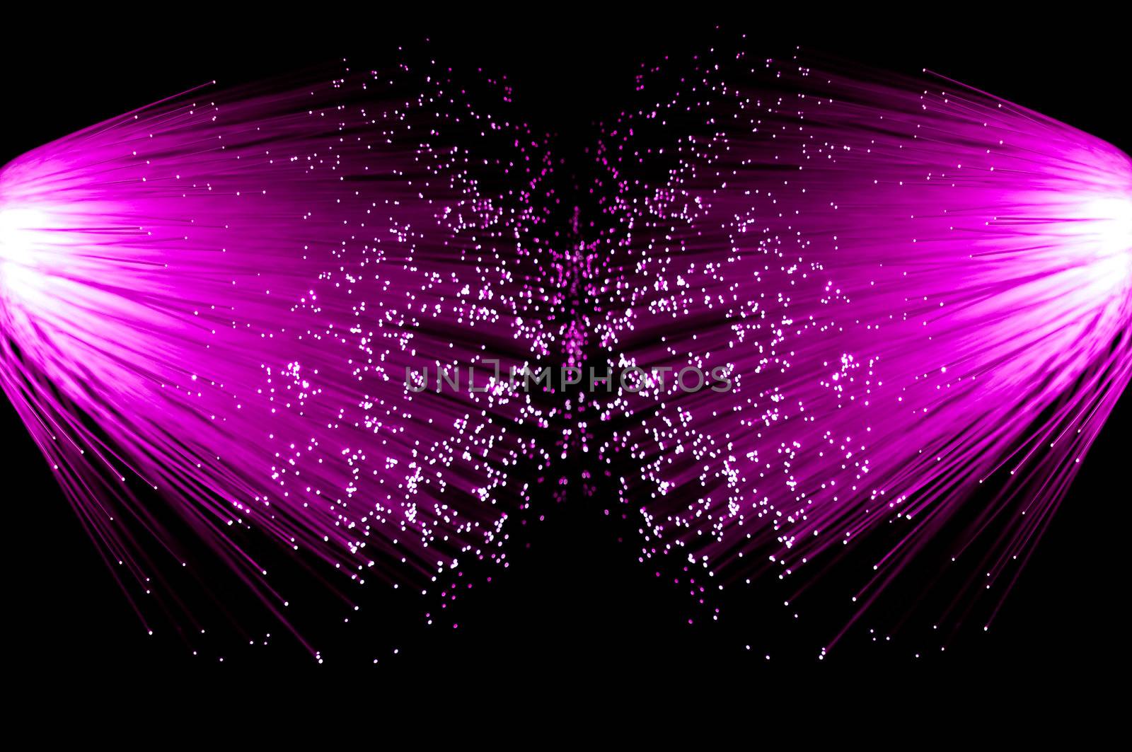 Two illuminated groups of bright pink fibre optic strands emanating from the left and right of the image. Black background.