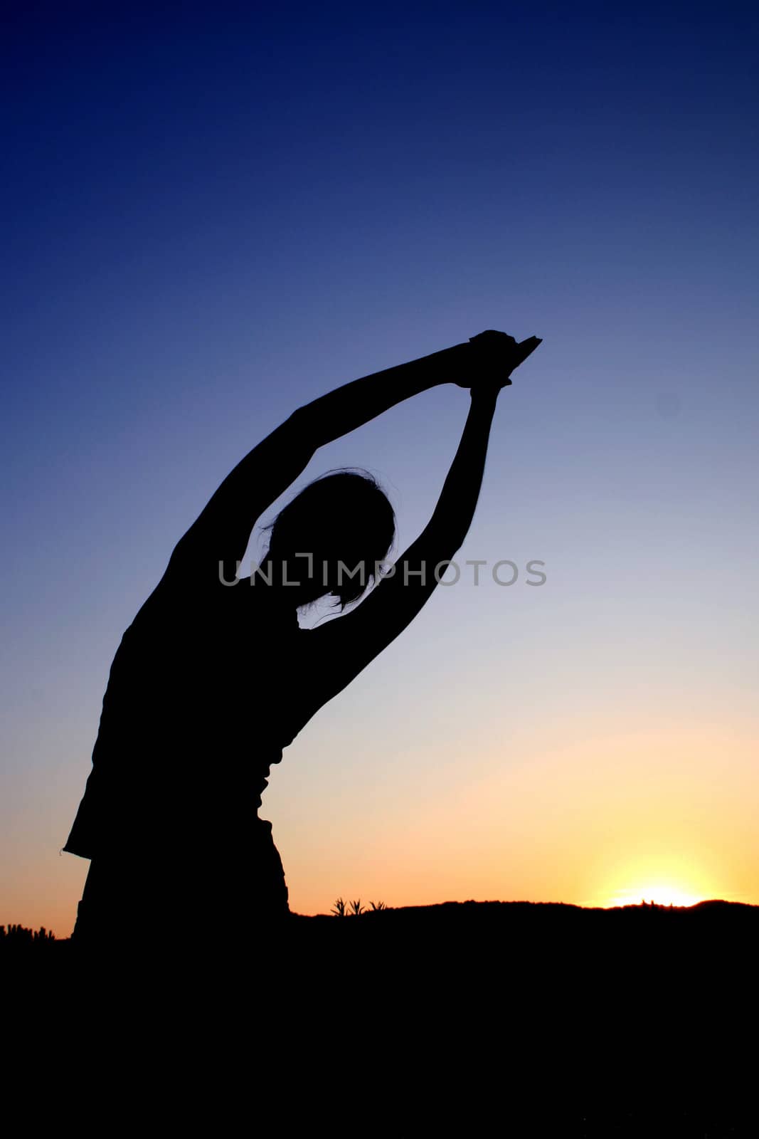 The yoga shadow during the sunset