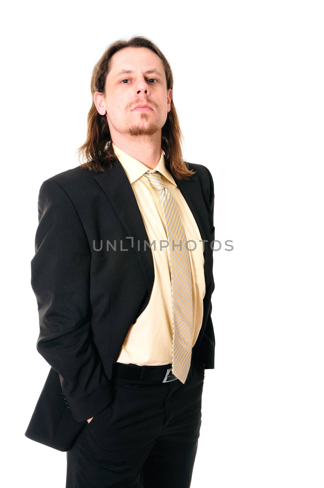 Young serious business man isolated on white background.