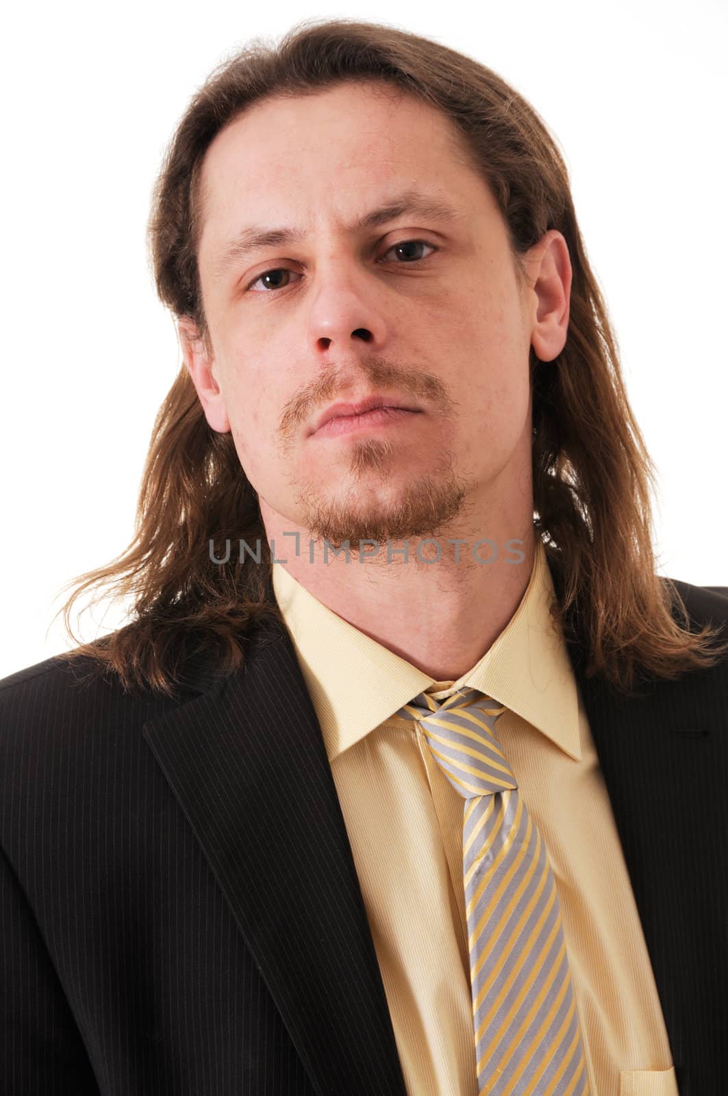 Young serious business man isolated on white background.