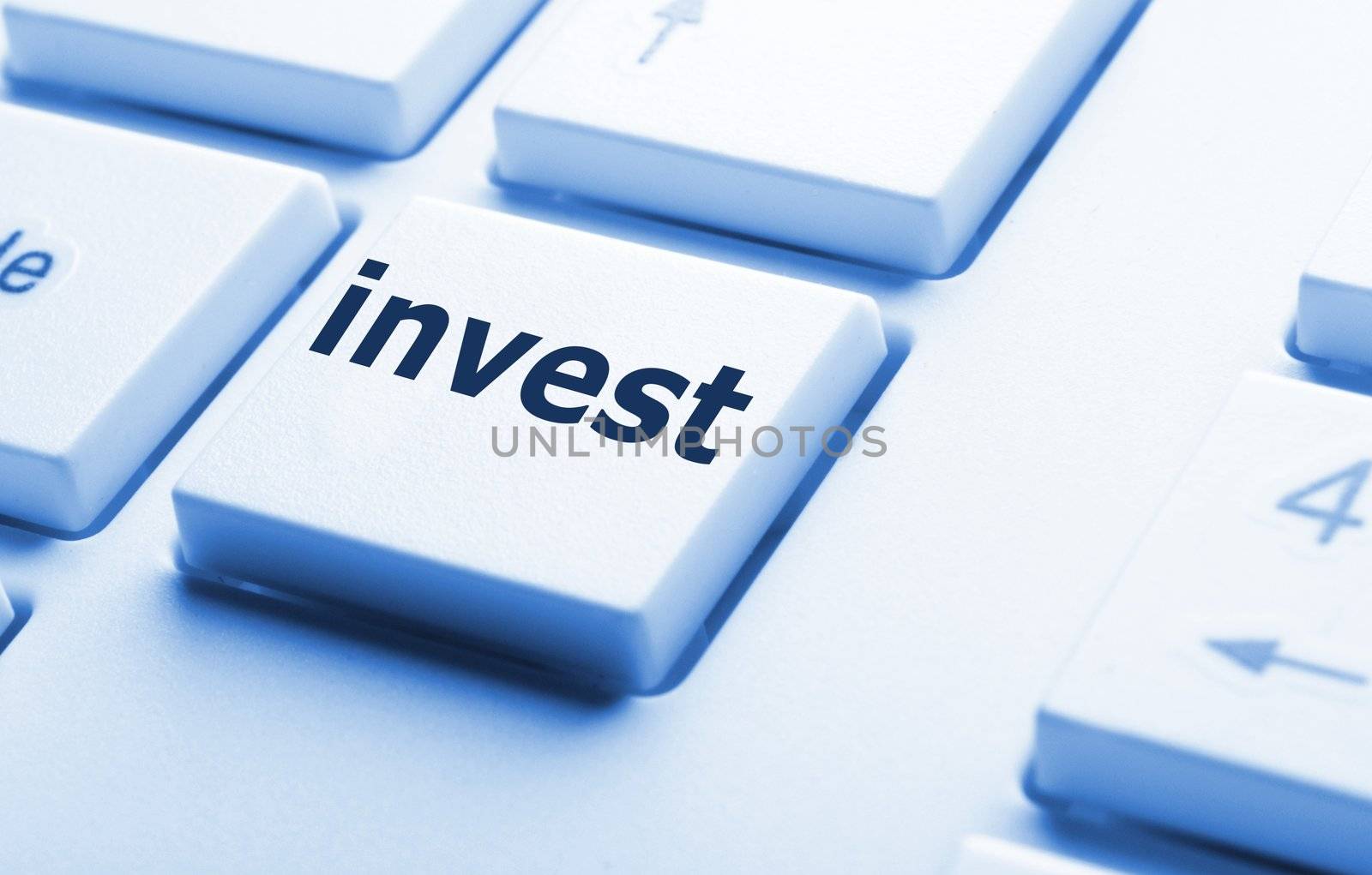 invest key on keyboard showing financial business investment concept