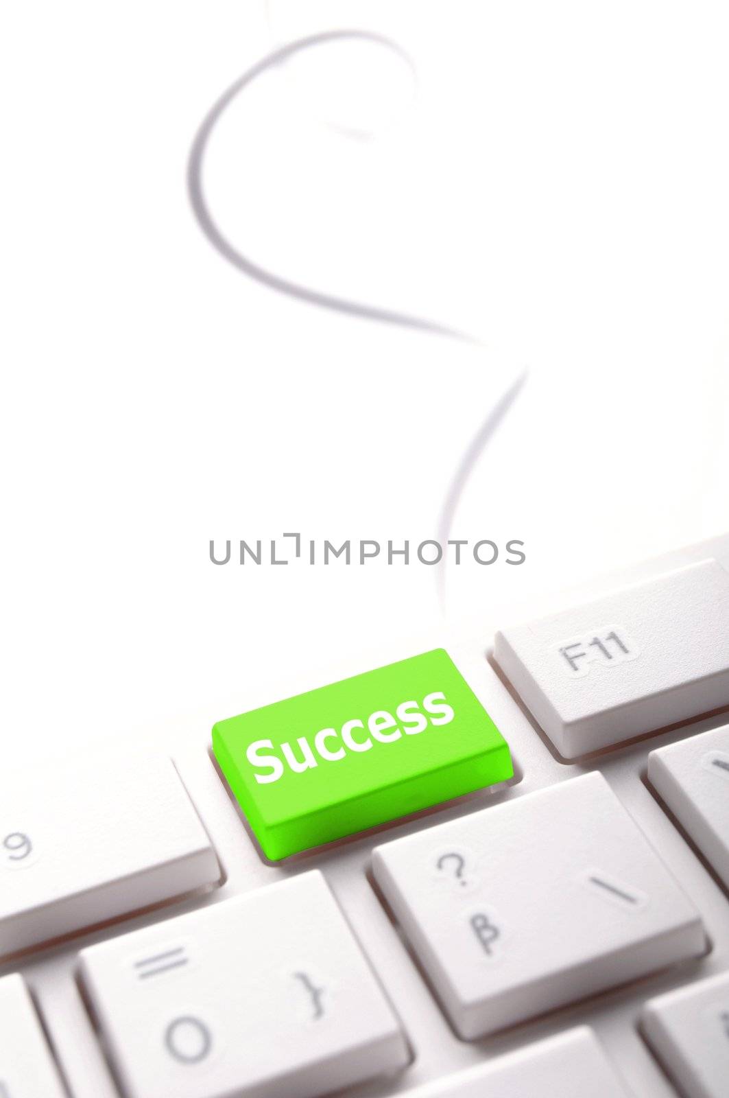 success in business concept with key on computer keyboard
