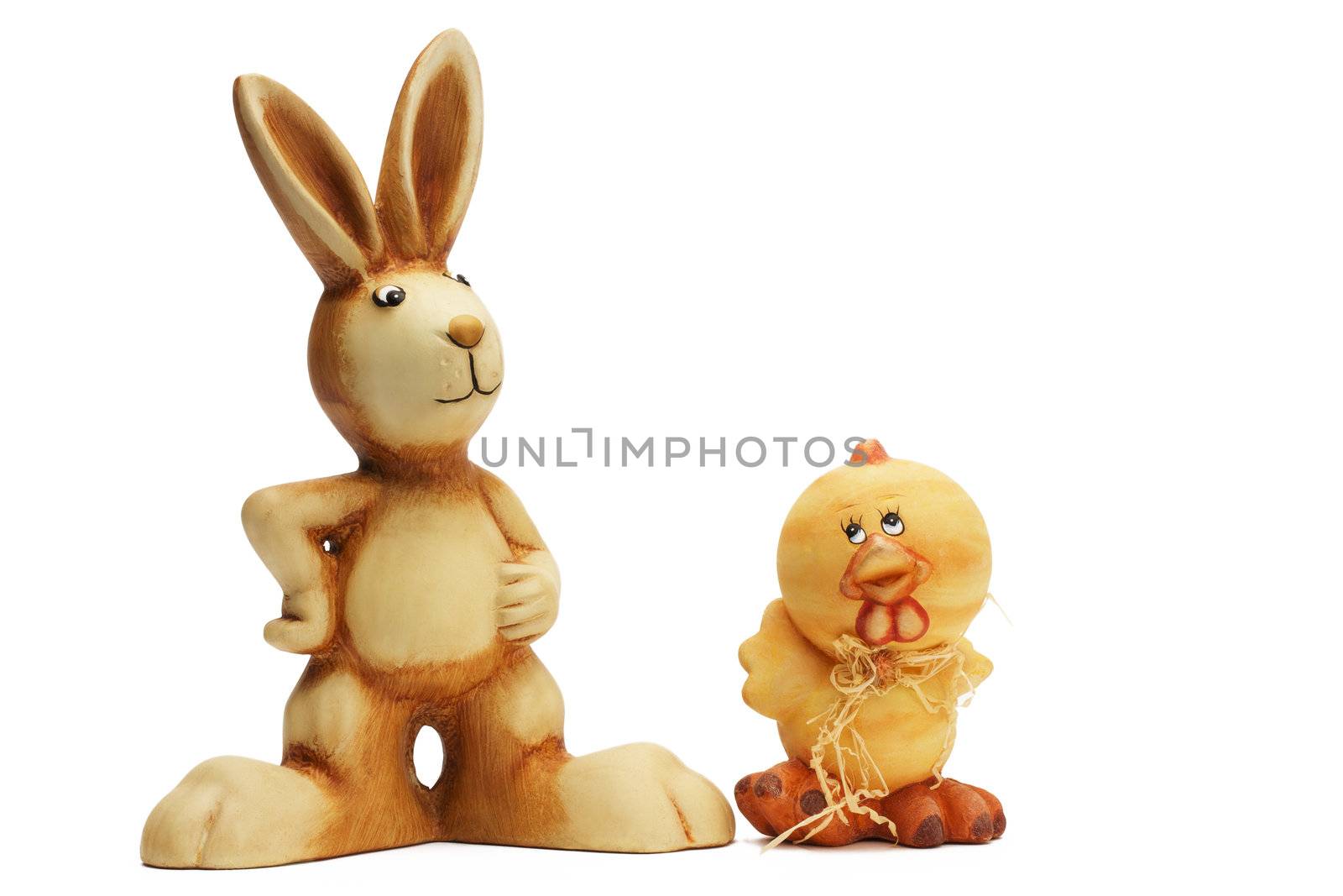 easter bunny and chicken figurines on white background