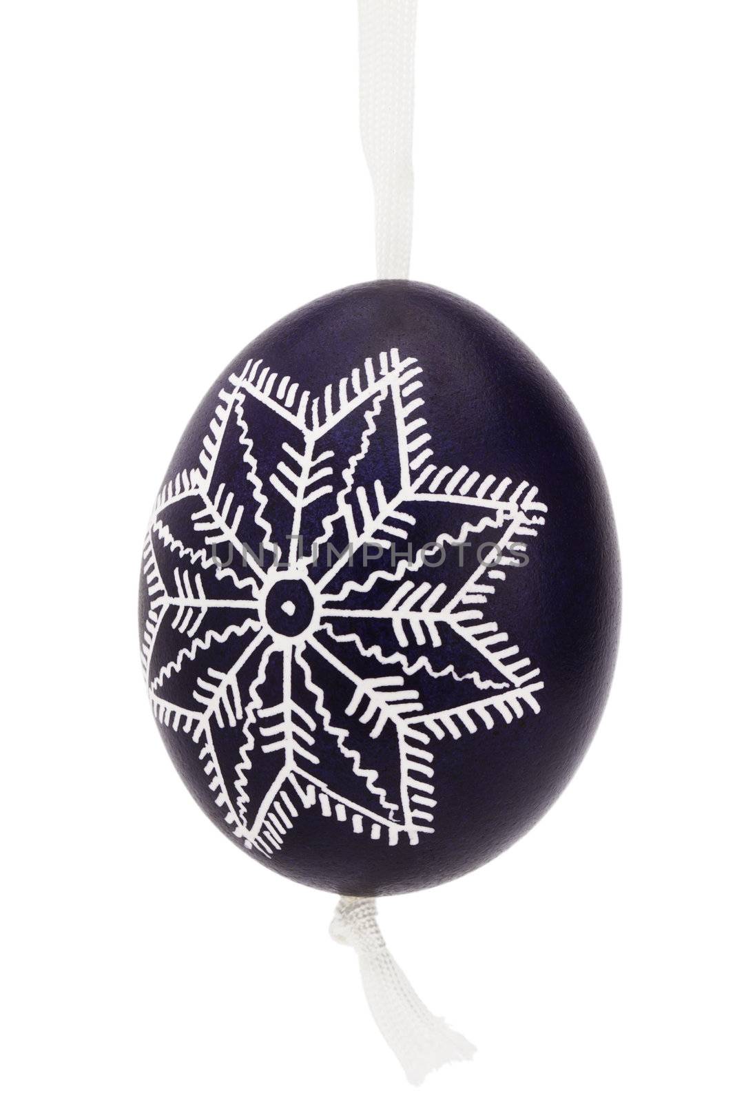 dark blue hanging hand painted easter egg on white background