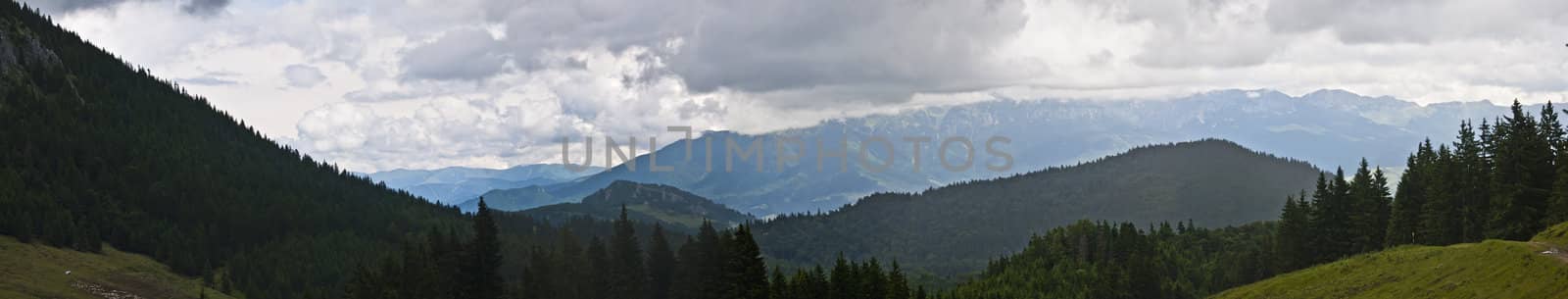 Panorama background in Carpathians. Beautiful mountains and landscape in Romania.