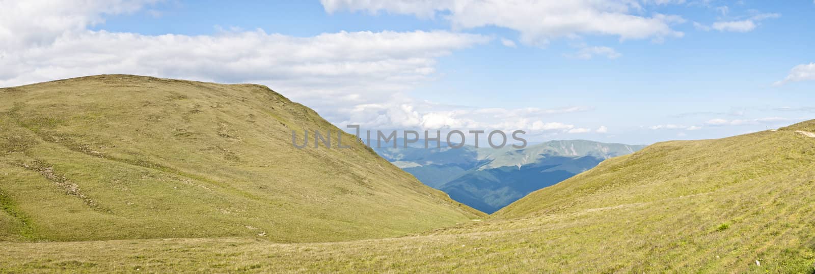 Panorama background in Carpathians. Beautiful mountains and landscape in Romania.