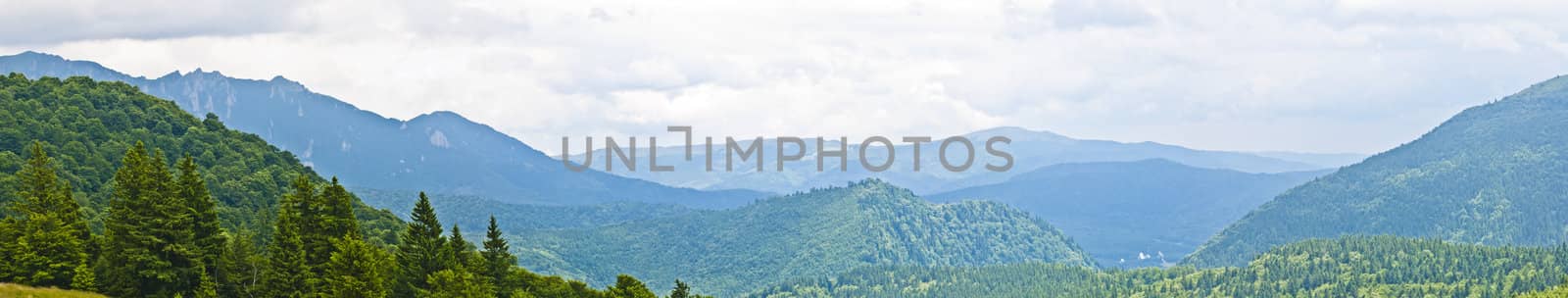 Panorama background in Carpathians. Beautiful mountains and landscape in Romania.